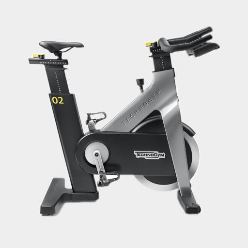 TechnoGym Group Cycle in grey on a white background available from Flair Fitness Bridgend, Co Donegal, Ireland